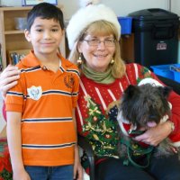 12/16/11 - Annual Christmas with Santa - Mission Education Center, San Francisco - Ms. Linda as Santa, with her dog Emma - Each student takes turns posing with Santa.