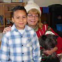 12/16/11 - Annual Christmas with Santa - Mission Education Center, San Francisco - Ms. Linda as Santa, with her dog Emma - Each student takes turns posing with Santa.