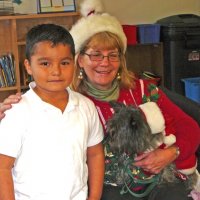 12/16/11 - Annual Christmas with Santa - Mission Education Center, San Francisco - Ms. Linda as Santa, with her dog Emma - Each student takes turns posing with Santa.