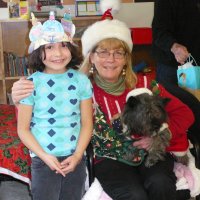 12/16/11 - Annual Christmas with Santa - Mission Education Center, San Francisco - Ms. Linda as Santa, with her dog Emma - Each student takes turns posing with Santa.