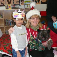 12/16/11 - Annual Christmas with Santa - Mission Education Center, San Francisco - Ms. Linda as Santa, with her dog Emma - Each student takes turns posing with Santa.