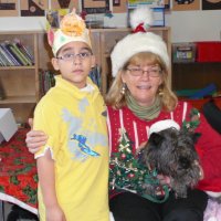 12/16/11 - Annual Christmas with Santa - Mission Education Center, San Francisco - Ms. Linda as Santa, with her dog Emma - Each student takes turns posing with Santa.