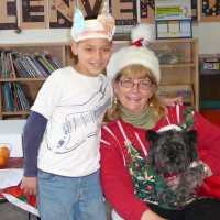 12/16/11 - Annual Christmas with Santa - Mission Education Center, San Francisco - Ms. Linda as Santa, with her dog Emma - Each student takes turns posing with Santa.