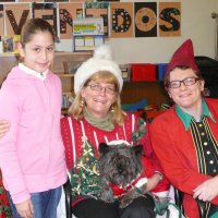 12/16/11 - Annual Christmas with Santa - Mission Education Center, San Francisco - Ms. Linda as Santa, with her dog Emma, and Jackie Cash as her Elf - Each student takes turns posing with Santa.