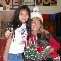 12/16/11 - Annual Christmas with Santa - Mission Education Center, San Francisco - Ms. Linda as Santa, with her dog Emma - Each student takes turns posing with Santa.