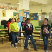 12/16/11 - Annual Christmas with Santa - Mission Education Center, San Francisco - A class walks in singing before visiting with Santa.