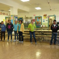 12/16/11 - Annual Christmas with Santa - Mission Education Center, San Francisco - A class performs a song before posing with Santa.