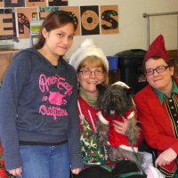 12/16/11 - Annual Christmas with Santa - Mission Education Center, San Francisco - Ms. Linda as Santa, with her dog Emma, and Jackie Cash as her Elf - Each student takes turns posing with Santa.