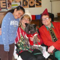 12/16/11 - Annual Christmas with Santa - Mission Education Center, San Francisco - Ms. Linda as Santa, with her dog Emma, and Jackie Cash as her Elf - Each student takes turns posing with Santa.