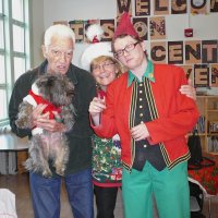12/16/11 - Annual Christmas with Santa - Mission Education Center, San Francisco - Al Gentile posing with Ms. Linda as Santa, with her dog Emma, and Jackie Cash as her Elf.