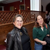 2/19/11 - 28th Annual Castagnetto / Spediacci Memorial Crab Feed - Italian American Social Club, San Francisco - Linda Workman, left, talking with Bre Jones just as the event is beginning. Others coming in and checking in.