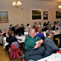 2/19/11 - 28th Annual Castagnetto / Spediacci Memorial Crab Feed - Italian American Social Club, San Francisco - Everyone listening to a raffle announcement from the end of the room. In the photo is: Diane Donnelly, Bob Fenech & Leona Wong, Bill Graziano, and Handford Clews, closest to the camera.