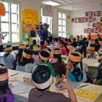 11/18/11 - Annual Thanksgiving Luncheon - Mission Education Center, San Francisco - Students look on as a class prepares to perform.