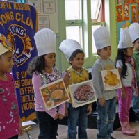 11/18/11 - Annual Thanksgiving Luncheon - Mission Education Center, San Francisco - Students performing while wearing representations of Thanksgiving dishes.