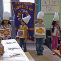 11/18/11 - Annual Thanksgiving Luncheon - Mission Education Center, San Francisco - Students performing while wearing representations of Thanksgiving dishes.