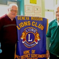 11/18/11 - Annual Thanksgiving Luncheon - Mission Education Center, San Francisco - Robert Quinn, left, and Al Gentile pose with the club banner.