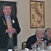 7/18/12 - Installation of Officers at the Italian American Social Club, San Francisco - PDG Eugene Chan deliveries pre-new member infomation while Joe & Emily Farrah enjoy dinner.