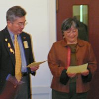 7/18/12 - Installation of Officers at the Italian American Social Club, San Francisco - New member Margine Sako, right, reviews info as PDG Eugene Chan looks on.