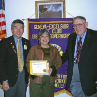 7/18/12 - Installation of Officers at the Italian American Social Club, San Francisco - New member Margine Sako, center, proudly displays her Certificate of Membership posing with installing officer PDG Eugene Chan, left, and sponsoring Lion Handford Clews.