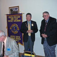 7/18/12 - Installation of Officers at the Italian American Social Club, San Francisco - Standing is PDG Eugene Chan, on left, installing Handford Clews as Treasurer. Seated are Diane & Ward Donnelly (outgoing President).