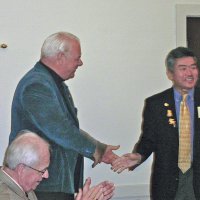 7/18/12 - Installation of Officers at the Italian American Social Club, San Francisco - Ward Donnelly, outgoing president, seated, looks on as Bob Quinn thanks installing officer PDG Eugene Chan for his efforts in installing the club officers.