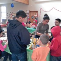 12-1-12 - Leo meeting, decorating party, and Bike Givaway. Sharon Eberhardt and May Wong at back table, center.