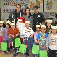 12-21-12 - Christmas with Santa at Mission Educational Center, San Francisco - A class poses with Santa after receiving their gift bags.