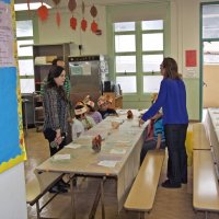 11-16-12 - Thanksgiving Luncheon, Mission Educational Center, San Francisco - The youngest classes start to filter in for lunch - May Wong on the far right.