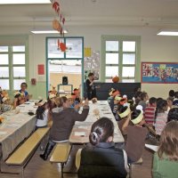 11-16-12 - Thanksgiving Luncheon, Mission Educational Center, San Francisco - Principal Deborah Molof introduces guests as the students applaud.