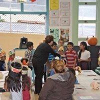 11-16-12 - Thanksgiving Luncheon, Mission Educational Center, San Francisco - Principal Deborah Molof helps a class prepare to sing a song.