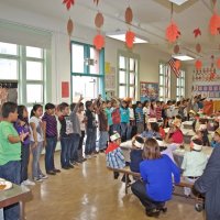 11-16-12 - Thanksgiving Luncheon, Mission Educational Center, San Francisco - Students singing their song while the other students, and Principal Molof, look on.