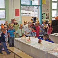 11-16-12 - Thanksgiving Luncheon, Mission Educational Center, San Francisco - The student in the turkey hat starts to strut as his classmates sing.