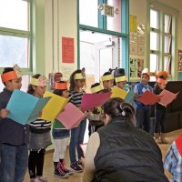 11-16-12 - Thanksgiving Luncheon, Mission Educational Center, San Francisco - Students sing a song led by their teacher.