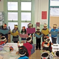 11-16-12 - Thanksgiving Luncheon, Mission Educational Center, San Francisco - Students sing a song led by their teacher.