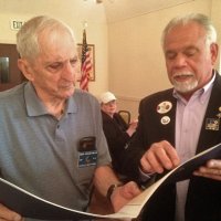 6-18-14 - Italian American Social Club, San Francisco - Presentation of International President’s Certificate of Appreciation to Lion Charles Bottarini for 60 years of service - Charlie Bottarini and District Governor Stephen Picchi reviewing the Certificate of Appreciation. Sharon Eberhardt, center background.