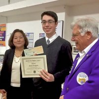 3-1-16 - Our Student Speaker contestant Roman Peregrino displaying his certificate for having won the Zone Student Speaker Contest. Zone Chairman Helen Casaclang on his right, and Rich Picchi on his left.