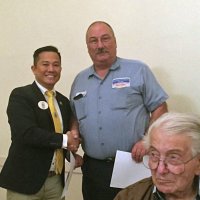 11-16-16 - District Governor Rod Mercado’s Official Visit, Italian American Social Club, San Francisco - Rod Mercado, District Governor, left, presenting Ward Donnelly his 25 Years of Service chevron. Joe Farrah in the foreground.
