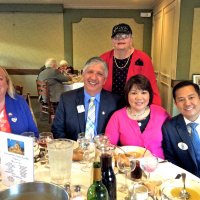 7-16-16 - 67th Installation of Officers, Basque Cultural Center, South San Francisco - L to R, seated: Cindy Smith, Mario & Rose Benavente, and District Governor Rod Mercado; standing: Sharon Eberhardt. Far back, left: Bob Fenech; back center: Gerald Lowe, and Arline Thomas.