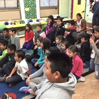 12-15-16 - Christmas with Santa with the help of Los Bomberos Firefighters, Mission Education Center, San Francisco - Students watching others visit with Santa.