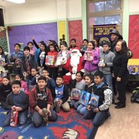 12-15-16 - Christmas with Santa with the help of Los Bomberos Firefighters, Mission Education Center, San Francisco - A class poses with Santa, the Los Bomberos Firefighters, and their teachers.