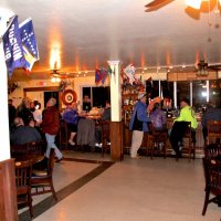 1-20-16 - Mariposa Hunters Point Yacht Club, San Francisco - Reviewing new venue for our upcoming Crab Feed - View of teh bar area from next to the fireplace. At table on left: George Salet, and Viela du Pont; Bob Fenech just under the television.