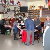 3-5-16 - Mariposa Hunters Point Yacht Club, San Francisco - 31st Annual Crab Feed - Setting up the tables in the front room are, l to r, Bob Fenech, Bill Graziano, Viela du Pont, Sharon Eberhardt, Stephen Martin, George Salet, and Jerry Lowe.