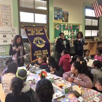 11-18-16 - MEC Thanksgiving Luncheon, Mission Education Center, San Francisco - Students wait patiently for lunch to be served as announcements are read.