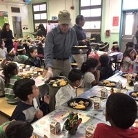 11-18-16 - MEC Thanksgiving Luncheon, Mission Education Center, San Francisco - Bill Graziano serving students lunch. Joe Farrah is standing far back left.