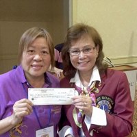 5-15-16 - District 4-C4 Convention, Red Lion Inn, Sacramento - May Wong, with District Governor Macy Mak Chan, proudly displaying the district check to our club for our sales efforts.