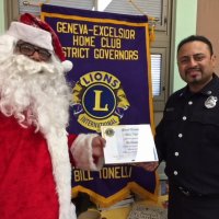 12/21/17 - Christmas with Santa, Mission Educational Center - Santa and one of his San Francisco Fireman escorts, from the SFFD Toys for Tots Program, with his certificate of thanks from the Geneva-Excelsior Lions Club.