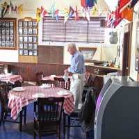 2-18-17 - 32nd Annual Crab Feed, Mariposa Hunters Point Yacht Club, San Francisco - Ward Donnelly woring on getting the front tables ready to go.