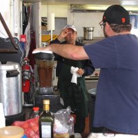 2-18-17 - 32nd Annual Crab Feed, Mariposa Hunters Point Yacht Club, San Francisco - Two helpers working in the kitchen; being blended is the salad dressing.