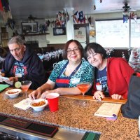 2-18-17 - 32nd Annual Crab Feed, Mariposa Hunters Point Yacht Club, San Francisco - The set up and most of the kitchen work done, L to R, Handford Clews, Viela du Pont, and Margot Clews pause for refreshment.