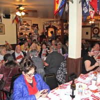 2-18-17 - 32nd Annual Crab Feed, Mariposa Hunters Point Yacht Club, San Francisco - Most, having found their seats, are talking with friends while waiting for dinner. Linda Workman, foreground, left center. Also seen are Bob Fenech, Sharon Eberhardt, and Handford Clews.